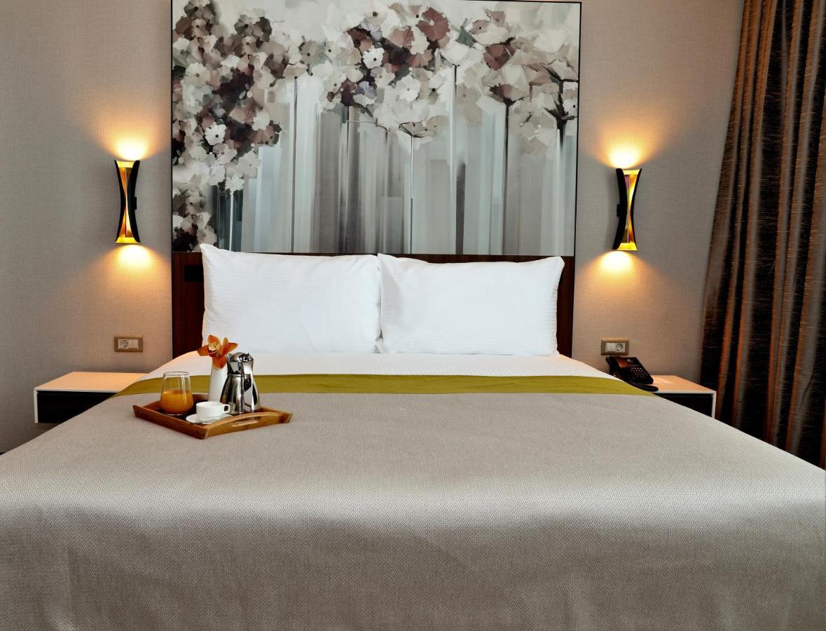 Limak Skopje Luxury Hotel Exterior photo A bedroom at the hotel