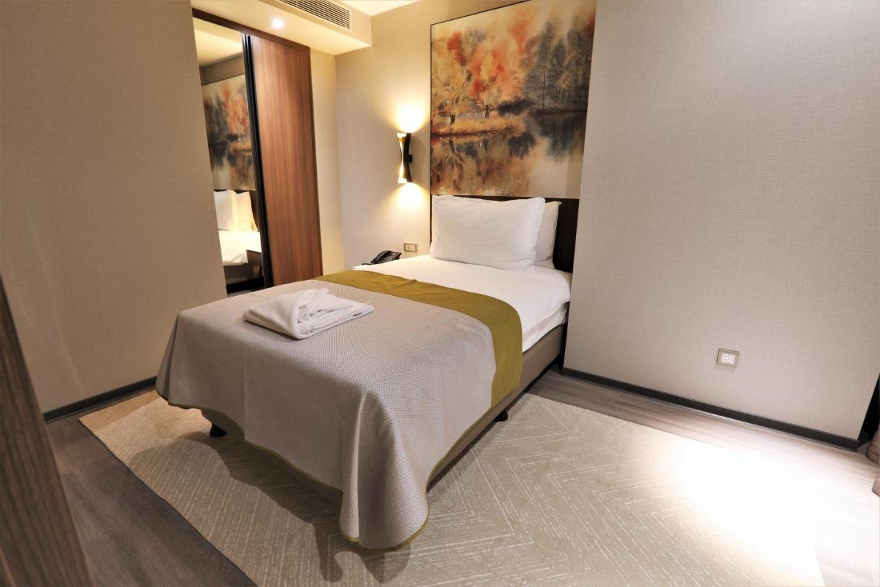 Limak Skopje Luxury Hotel Exterior photo A bedroom in a hotel